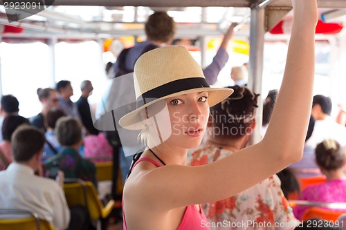 Image of Tourist traveling by public transport.