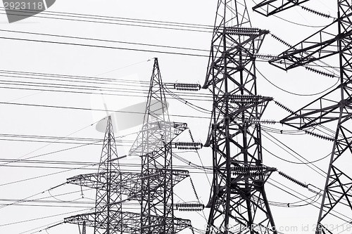 Image of High-voltage power transmission towers.