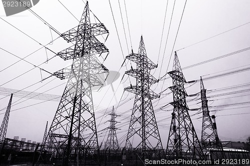 Image of High-voltage power transmission towers.