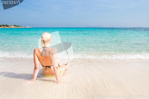 Image of woman relaxing on the beach.