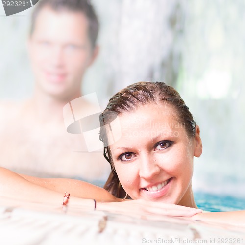 Image of Young couple in the swimming pool.