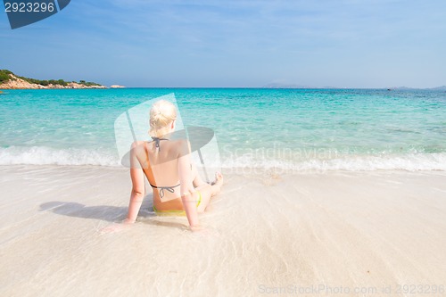 Image of woman relaxing on the beach.