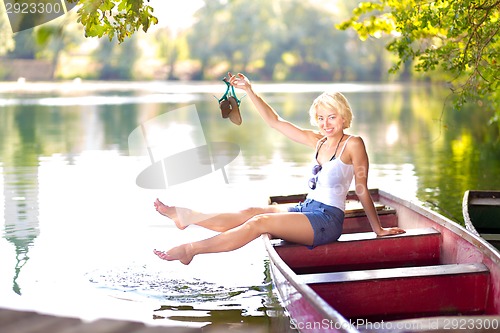 Image of Woman enjoing the sunny summer day,