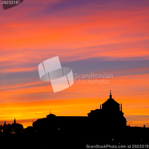 Image of Silhouette of catholic church in sunset.