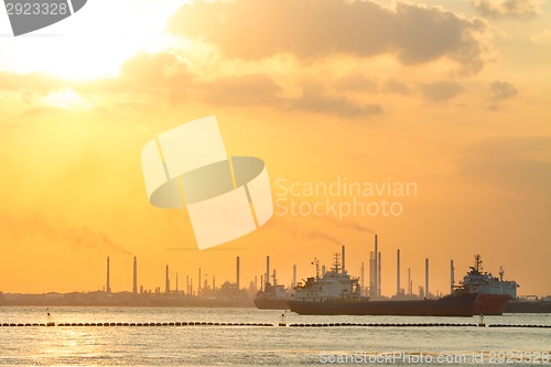 Image of Tanker ships in front of refinery.