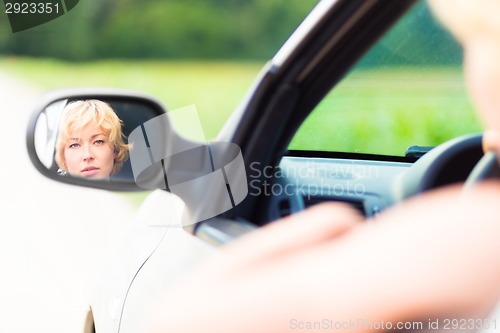 Image of Lady driving a car.