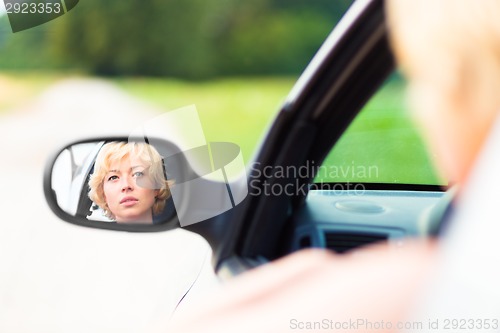 Image of Lady driving a car.