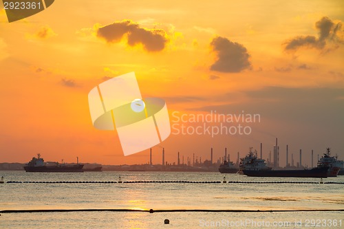 Image of Tanker ships in front of refinery.