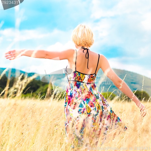 Image of Woman enjoying the nature.