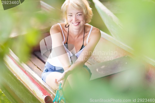 Image of Woman enjoing the sunny summer day,