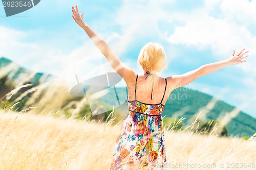 Image of Woman enjoying the nature.