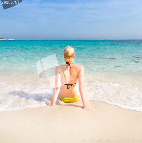 Image of woman relaxing on the beach.