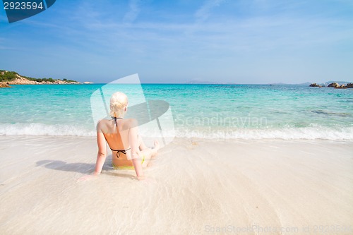 Image of woman relaxing on the beach.