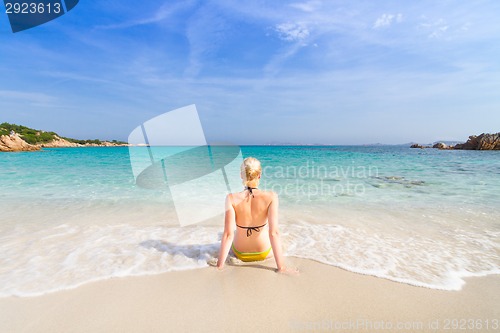 Image of woman relaxing on the beach.