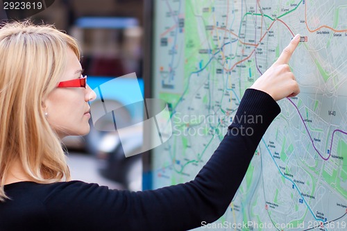 Image of Woman looking on the metro map board