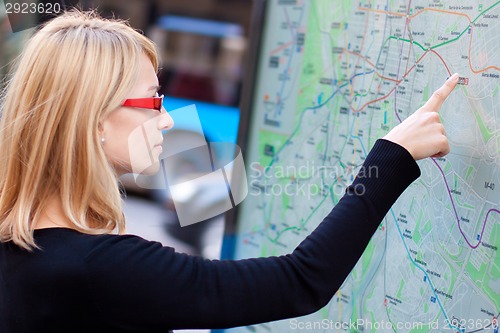 Image of Woman looking on the metro map board