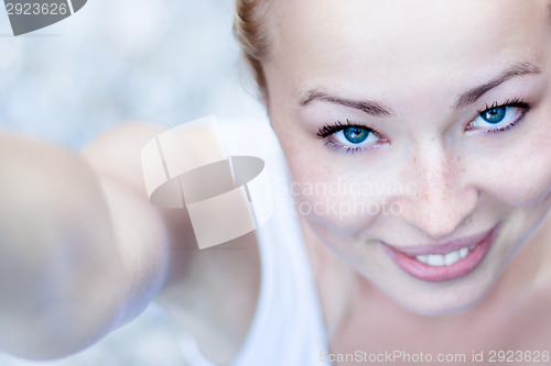 Image of Portrait of a cheerful young woman.