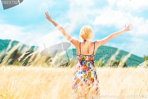 Image of Woman enjoying the nature.