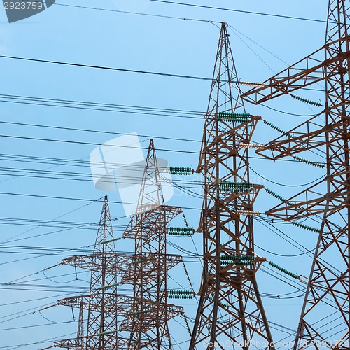 Image of High-voltage power transmission towers.