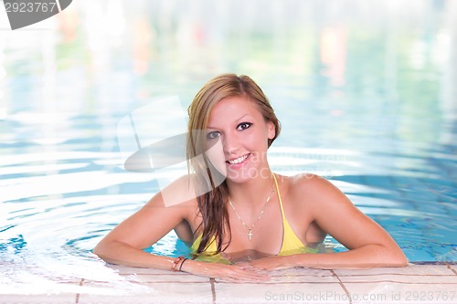 Image of Young woman in the swimming pool.