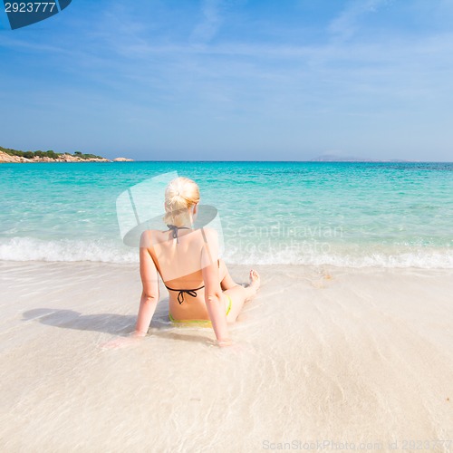 Image of woman relaxing on the beach.