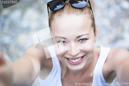 Image of Portrait of a cheerful young woman.