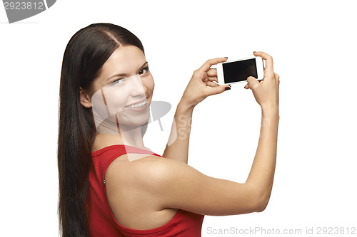 Image of Woman taking pictures through cell phone