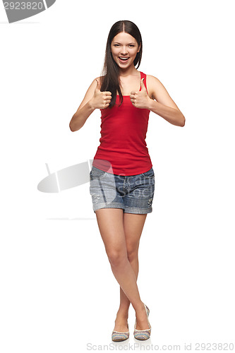 Image of Smiling emotional girl giving you thumb up