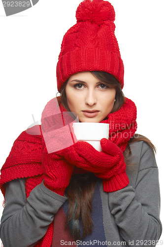 Image of Winter woman holding tea cup