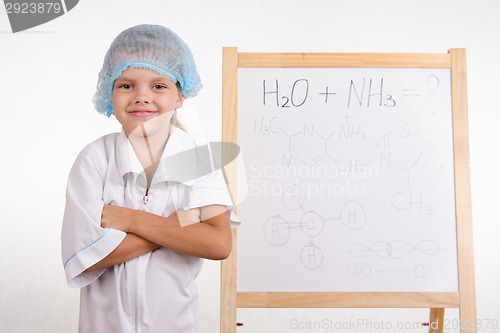 Image of Portrait of a Girl chemist at the blackboard