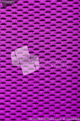 Image of synthetic magenta cloth. grid closeup. macro