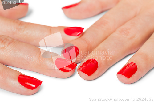 Image of Woman with beautiful manicured red fingernails