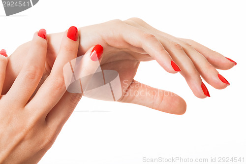 Image of Woman with beautiful manicured red fingernails