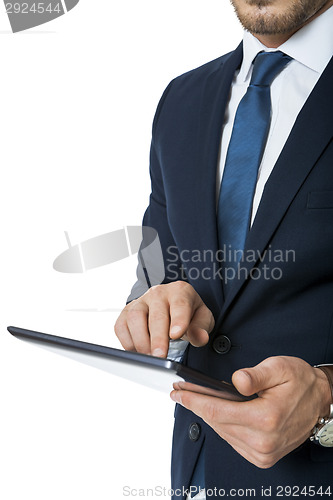 Image of Businessman using a tablet computer