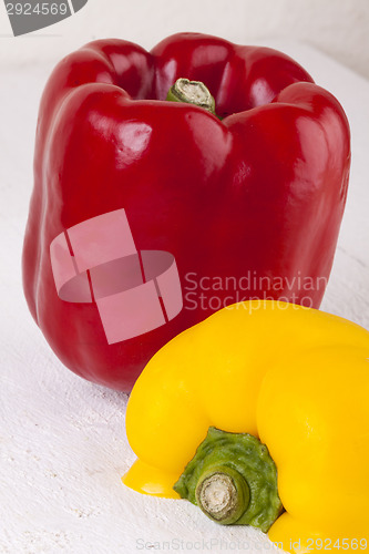 Image of Red and Yellow Peppers on White Background