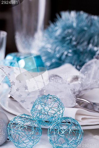 Image of Stylish blue and silver Christmas table setting