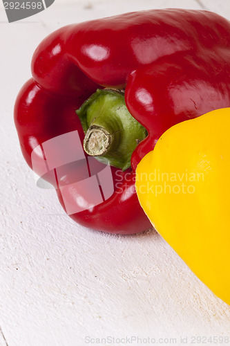 Image of Red and Yellow Peppers on White Background