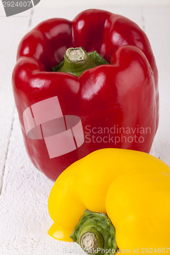 Image of Red and Yellow Peppers on White Background