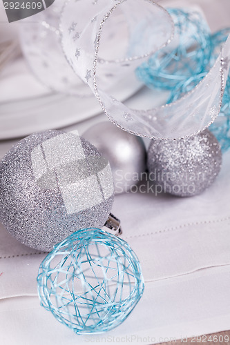 Image of Stylish blue and silver Christmas table setting