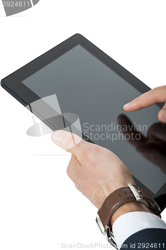 Image of Businessman using a tablet computer