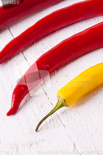 Image of Fresh red and yellow chili peppers with spice