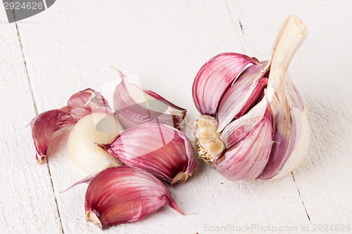 Image of Fresh garlic bulb with loose cloves