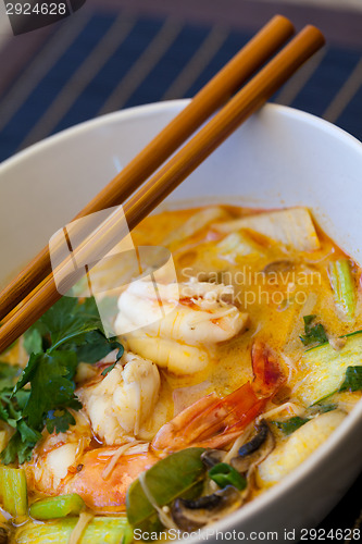 Image of Bowl of traditional Thai tom yam soup