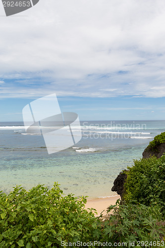 Image of Beautiful tropical beach with lush vegetation