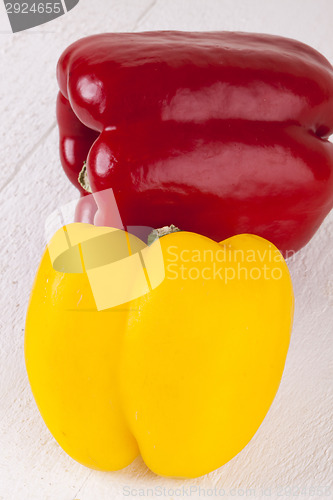 Image of Red and Yellow Peppers on White Background