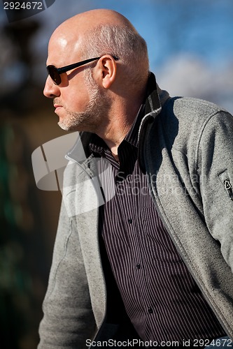 Image of Stylish man in sunglasses enjoying the sun