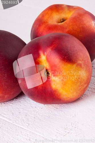 Image of Three tasty fresh ripe juicy nectarines