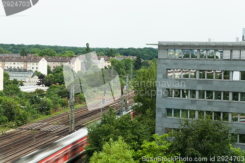 Image of Fast moving train with red stripe