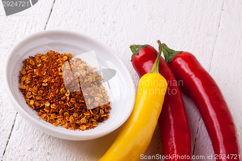 Image of Fresh red and yellow chili peppers with spice