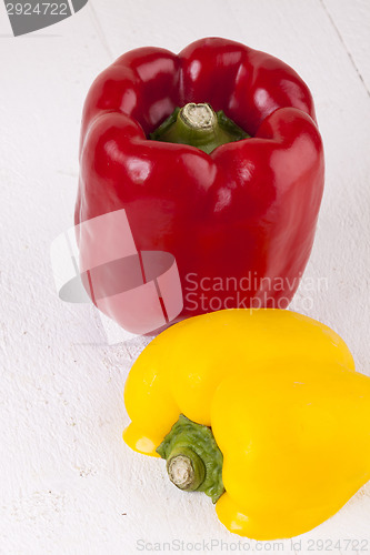 Image of Red and Yellow Peppers on White Background